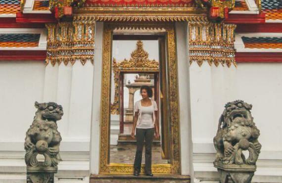 Blue-Roads traveler exploring an Asian temple.